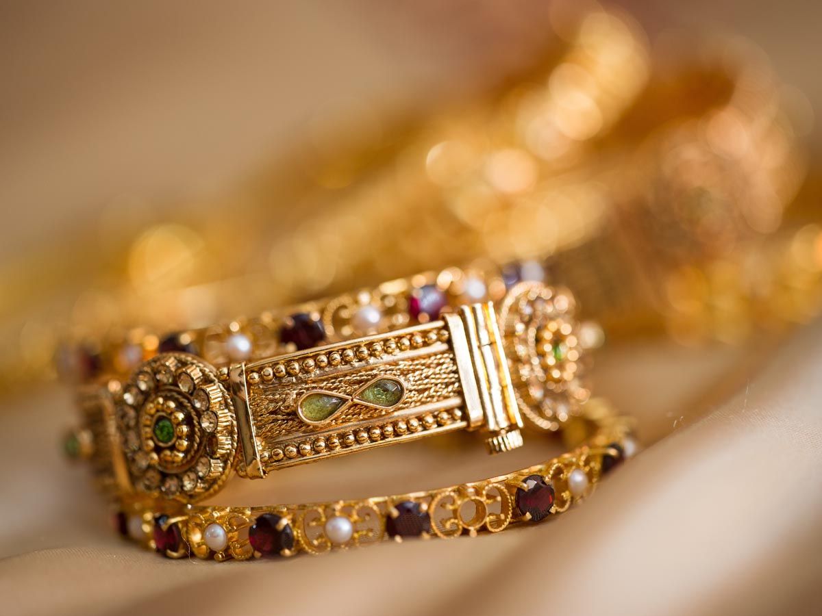 beautiful-golden-bracelets-decorated-with-stones-and-carvings